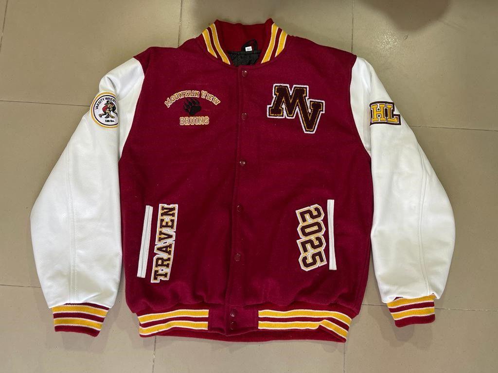 Red and white varsity jacket with patches and chest letters from GMB's portfolio