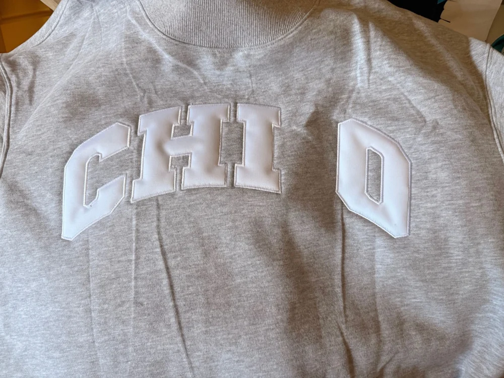 Gray Chi O sweatshirt with raised white lettering