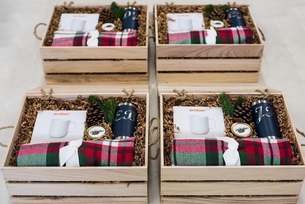 Wooden gift crates styled with a plaid blanket, Ember mug and monogrammed insulated tumbler