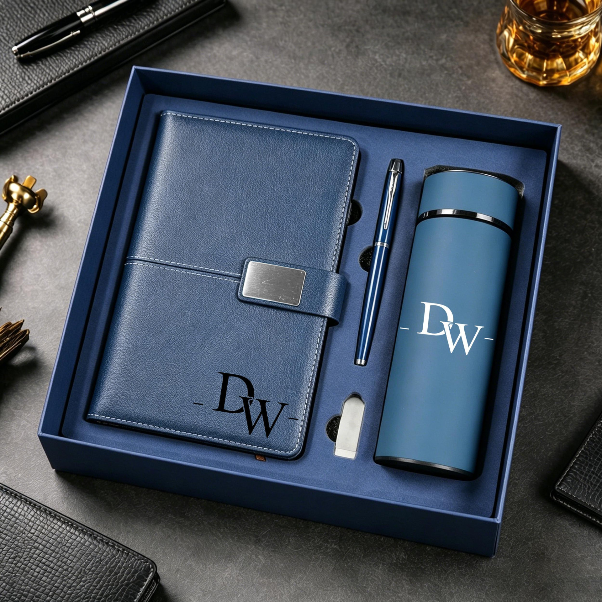 Gift box set with a monogrammed journal, pen and insulated tumbler
